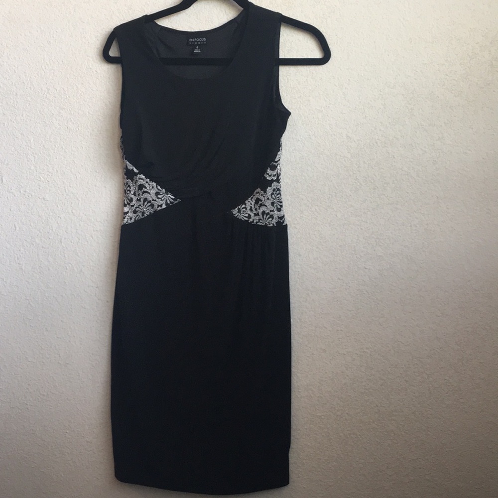 Black Enfocus studio dress with white detailing.